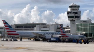 American Airlines planes are seen at the gates at Miami International Airport (MIA) on August 1, 2021 in Miami, Florida. (Photo by Daniel SLIM / AFP) (Photo by DANIEL SLIM/AFP via Getty Images)