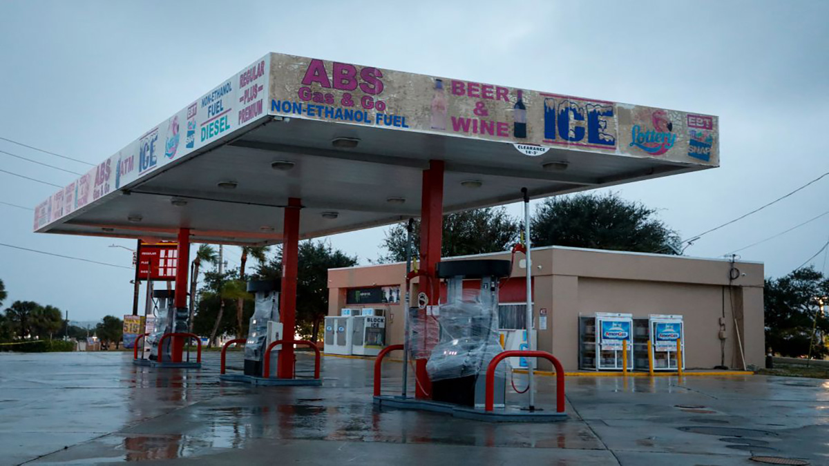 Pumps at a closed gas station are wrapped in plastic before Hurricane Nicole makes landfall in Jensen Beach, Florida on November 9, 2022. – Nicole, now a category 1 hurricane, is expected to make landfall over Florida’s coast overnight. (Photo by Eva Marie UZCATEGUI / AFP) (Photo by EVA MARIE UZCATEGUI/AFP via Getty Images)