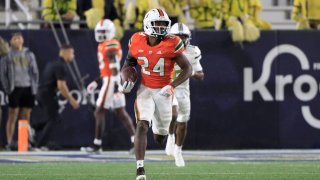 ATLANTA, GA – NOVEMBER 12: Miami Hurricanes safety Kamren Kinchens (24) runs back an interception for a touchdown during the Saturday afternoon college football game between the Miami Hurricanes and the Georgia Tech Yellow Jackets on November 12, 2022 at Bobby Dodd Stadium in Atlanta, GA. (Photo by David J. Griffin/Icon Sportswire via Getty Images)