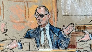 This courtroom sketch shows Oath Keepers founder Stewart Rhodes on the stand testifying in his own defense in the Jan. 6 seditious conspiracy trial, on Nov. 4, 2022.