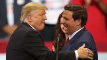 ESTERO, FL - OCTOBER 31: President Donald Trump greets Florida Republican gubernatorial candidate Ron DeSantis during a campaign rally at the Hertz Arena on October 31, 2018 in Estero, Florida. President Trump continues traveling across America to help get the vote out for Republican candidates running for office. (Photo by Joe Raedle/Getty Images)