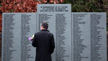 FILE - A man looks at the main memorial stone in memory of the victims of the bombing of Pan Am flight 103, in the garden of remembrance near Lockerbie, Scotland Friday Dec. 21, 2018. U.S. and Scottish authorities said Sunday, Dec. 11, 2022 that the Libyan man suspected of making the bomb that destroyed a passenger plane over Lockerbie, Scotland, in 1988 is in U.S. custody. (AP Photo/Scott Heppell, File)