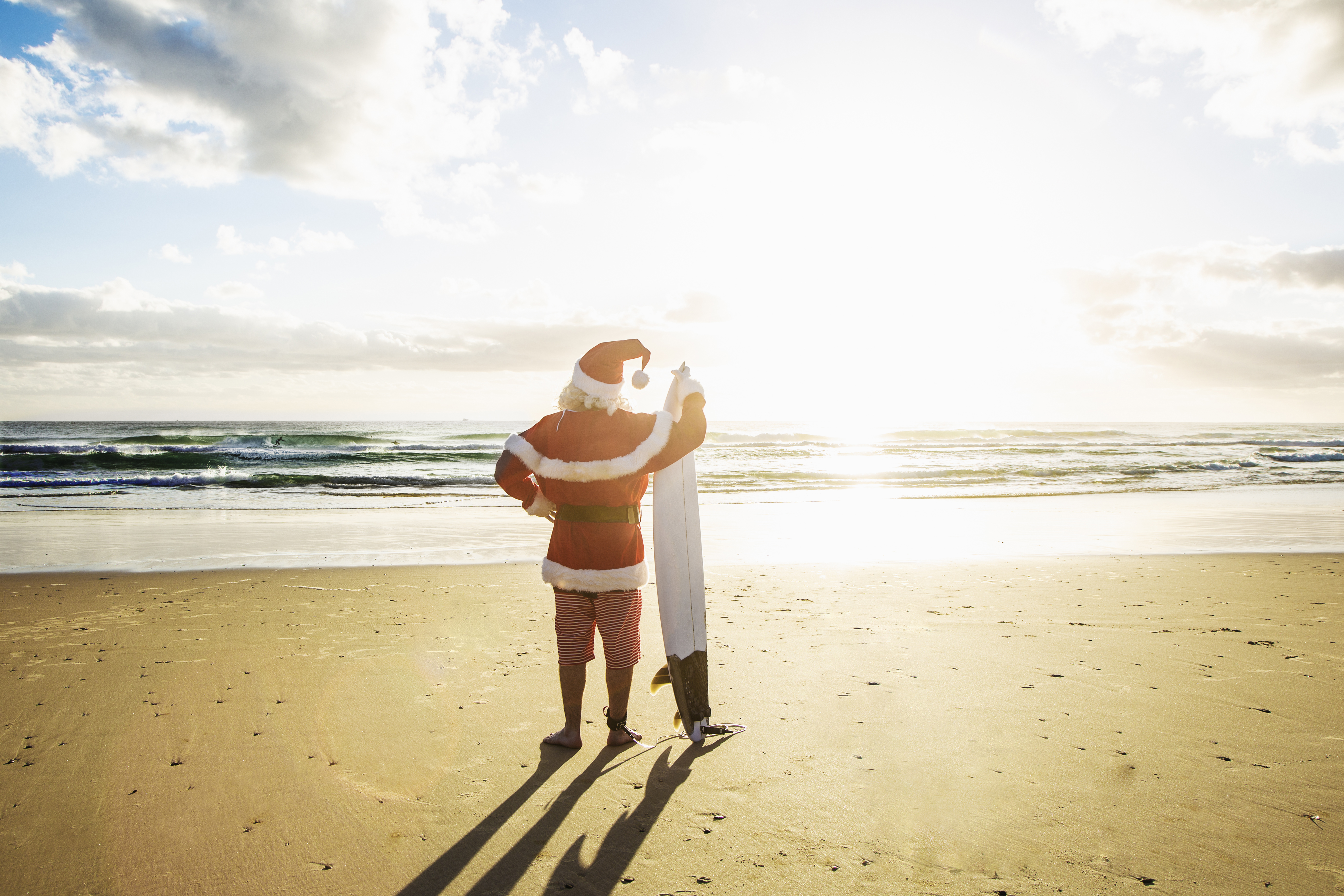 Frigid Weather Doesn't Stop Santas Surfing Off Florida Coast