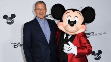 Bob Iger poses with Mickey Mouse attends Mickey's 90th Spectacular at The Shrine Auditorium on October 6, 2018 in Los Angeles.
