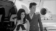 Elvis and Priscilla Presley Posing near Airplane