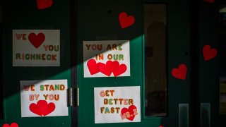 Messages of support for teacher Abby Zwerner, who was shot by a 6-year-old student, grace the front door of Richneck Elementary School in Newport News, Va., on Jan. 9, 2023.