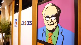 An Andy Warhol-like print of Berkshire Hathaway CEO Warren Buffett hangs outside a clothing stand during the first in-person annual meeting since 2019 of Berkshire Hathaway Inc in Omaha, Nebraska, U.S. April 30, 2022.