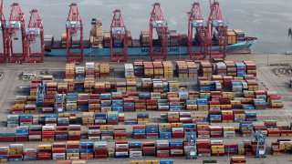Shipping containers at a container terminal at the Port of Long Beach-Port of Los Angeles complex, in Los Angeles, California, April 7, 2021.
