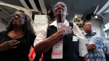 World War II veteran Lawrence Brooks holds his hand to his heart during the singing of the National Anthem as he celebrates his 110th birthday at the National World War II Museum in New Orleans, Thursday, Sept. 12, 2019. Brooks was born Sept. 12, 1909, and served in the predominantly African-American 91st Engineer Battalion, which was stationed in New Guinea and then the Philippines during World War II. He was a servant to three white officers in his battalion. (AP Photo/Gerald Herbert)