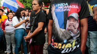 Supporters of Nicaraguan President Daniel Ortega take part in a march called “Amor, Paz y Alegria” in Managua, on June 12, 2022. – Hundreds of Sandinistas marched Sunday through Managua’s poor neighborhoods to express their support for Daniel Ortega’s government and to remember their fallen heroes in July 1979 revolution. (Photo by OSWALDO RIVAS / AFP) (Photo by OSWALDO RIVAS/AFP via Getty Images)