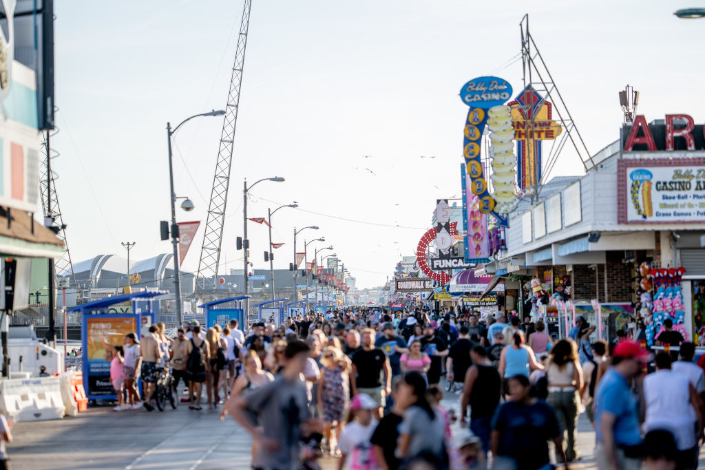 Summer tourists flock to boardwalks and piers while sticking to their budgets