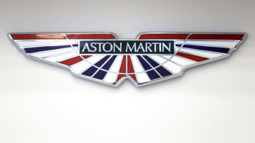 An Aston Martin badge bearing the colors of the Union flag, also known as the Union Jack.