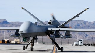 An MQ-9 Reaper remotely piloted aircraft (RPA) taxis during a training mission at Creech Air Force Base on November 17, 2015 in Indian Springs, Nevada.