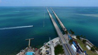 MARATHON  FL – MARCH 25: The Sunset Grille and Pier on the left, looking south on Overseas Highway 1 March 25, 2019 Sunset Grille, Marathon, Florida (Photo by Paul Harris/Getty Images)