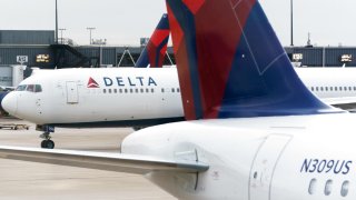 Delta Air Lines airplanes at the Hartsfield-Jackson Atlanta International Airport (ATL) in Atlanta, Georgia, on Tuesday, Dec. 21, 2021.