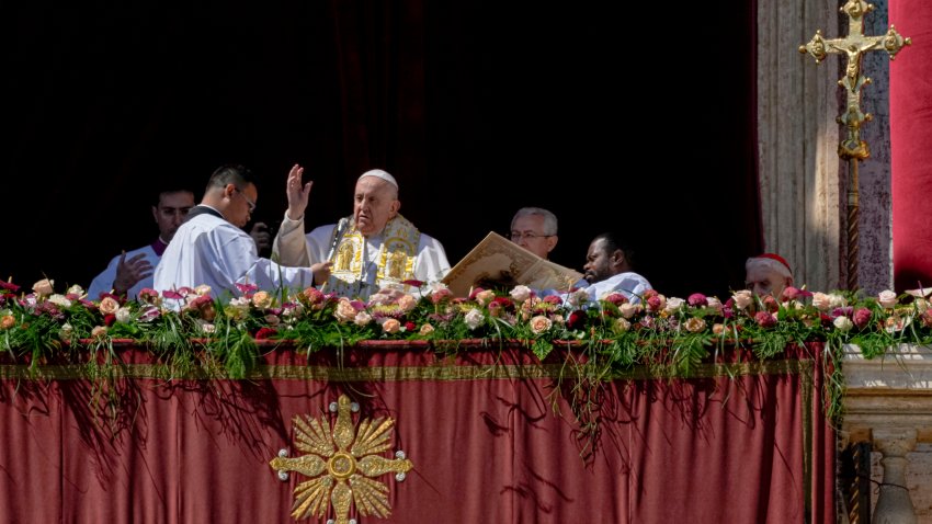 Pope Francis bestows the plenary ‘Urbi et Orbi’ (to the city and to the world) blessing from the central lodge of the St. Peter’s Basilica at The Vatican at the end of the Easter Sunday mass, Sunday, April 9, 2023. (AP Photo/Alessandra Tarantino)