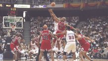 26 May 1997:  Forward P.J. Brown of the Miami Heat and guard Ron Harper of the Chicago Bulls watch the jump ball during a playoff game at the Miami Arena in Miami, Florida.  The Heat won the game 87-80. Mandatory Credit: Andy Lyons  /Allsport