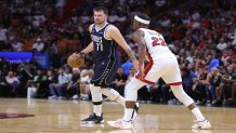 MIAMI, FLORIDA - APRIL 01: Luka Doncic #77 of the Dallas Mavericks drives against Jimmy Butler #22 of the Miami Heat during the second quarter of the game at Miami-Dade Arena on April 01, 2023 in Miami, Florida. NOTE TO USER: User expressly acknowledges and agrees that, by downloading and or using this photograph, User is consenting to the terms and conditions of the Getty Images License Agreement. (Photo by Megan Briggs/Getty Images)