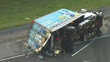 An overturned box truck is seen following a crash on the Florida's Turnpike in Broward on May 10, 2023.