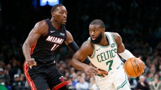 Dec 4, 2019; Boston, MA, USA; Boston Celtics guard Jaylen Brown (7) drives against Miami Heat center Bam Adebayo (13) during the second half at TD Garden. Mandatory Credit: Greg M. Cooper-USA TODAY Sports