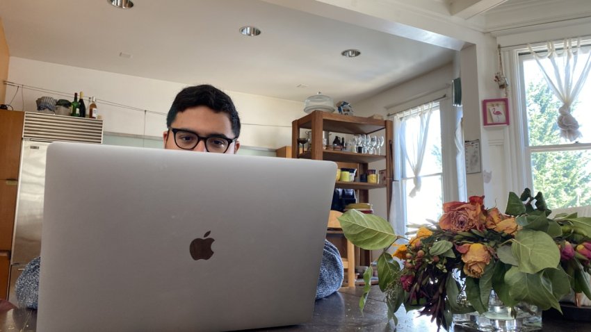 Diego Martinez sits at a laptop in the San Francisco home where he lives. NBC Bay Area Photo/ Alyssa Goard.