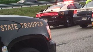 File image of Florida Highway Patrol troopers responding to a shooting on Interstate 95
