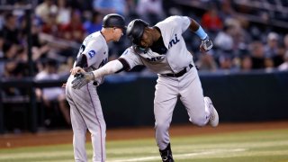 PHOENIX, ARIZONA – MAY 10: Jesus Sanchez #7 of the Miami Marlins celebrates his three run home run with third base coach Jody Reed #33 during the fourth inning against the Arizona Diamondbacks at Chase Field on May 10, 2023 in Phoenix, Arizona. (Photo by Chris Coduto/Getty Images)