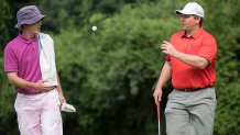 Rep. Trey Gowdy, R-S.C.,  tosses a golf ball to Rep. Ron DeSantis, R-Fla., after finishing hole 6 during the First Tee Congressional Challenge golf tournament at the Columbia Country Club in Chevy Chase, Md., on Monday morning, July 27, 2015. (Photo By Al Drago/CQ Roll Call)