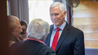 FILE - Former Vice President Mike Pence greets guests at a "Lumber and Lobster" event on May 17, 2023, in Dover, New Hampshire.