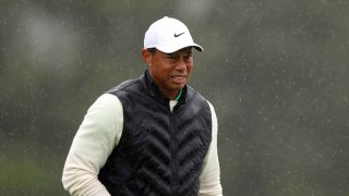 Tiger Woods of the United States looks on from the 18th green during the continuation of the weather delayed second round of the 2023 Masters Tournament at Augusta National Golf Club on April 08, 2023 in Augusta, Georgia.