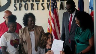 Michigan Gov. Gretchen Whitmer signs Crown Act legislation on Thursday, June 15, 2023 in Lansing, Mich.