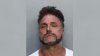 Man arrested after 30 dogs were found in cages at an illegal dumping facility in Miami-Dade