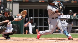 CHICAGO, IL – JUNE 10: Miami Marlins third baseman Jean Segura (9) hits a pop up to Chicago White Sox first baseman Andrew Vaughn (25) during a Major League Baseball game between the Miami Marlins and the Chicago White Sox on June 10, 2023 at Guaranteed Rate Field in Chicago, IL. (Photo by Melissa Tamez/Icon Sportswire via Getty Images)