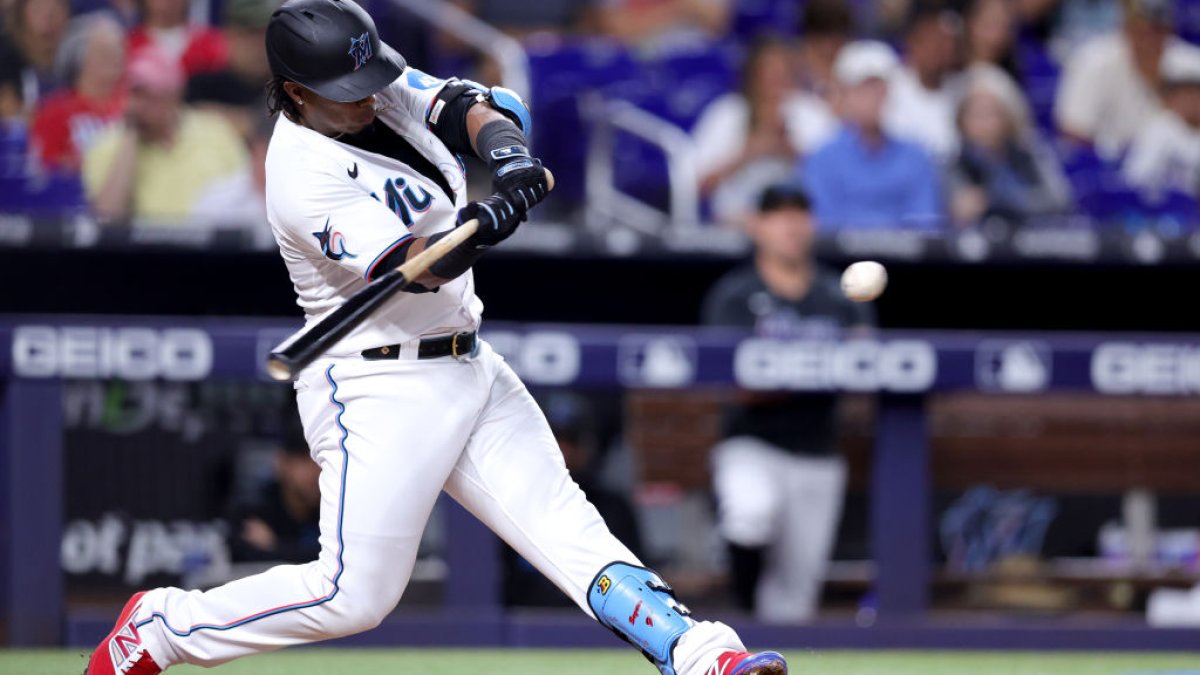 Miami Marlins' Jean Segura (9) hits a single to score the winning