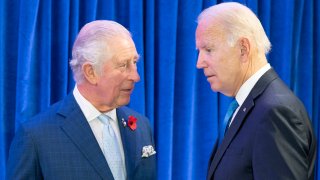 Britain's Prince Charles, left, greets the President of the United States Joe Biden