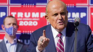 FILE - Former New York City Mayor Rudy Giuliani, a lawyer for President Donald Trump, speaks during a news conference at Four Seasons Total Landscaping on legal challenges to vote counting in Philadelphia, Pennsylvania, on Nov. 7, 2020.