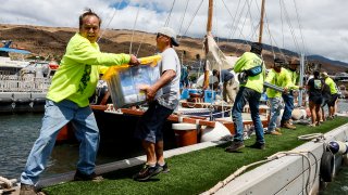 Supplies for Lahaina fire victims are gathered and delivered by Hawaiians sailing on a large catamaran in Maalaea, Maui, on Monday, Aug. 14, 2023.