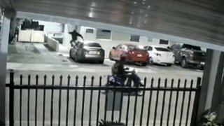 Surveillance video shows Miami car burglary suspects arriving on a scooter.