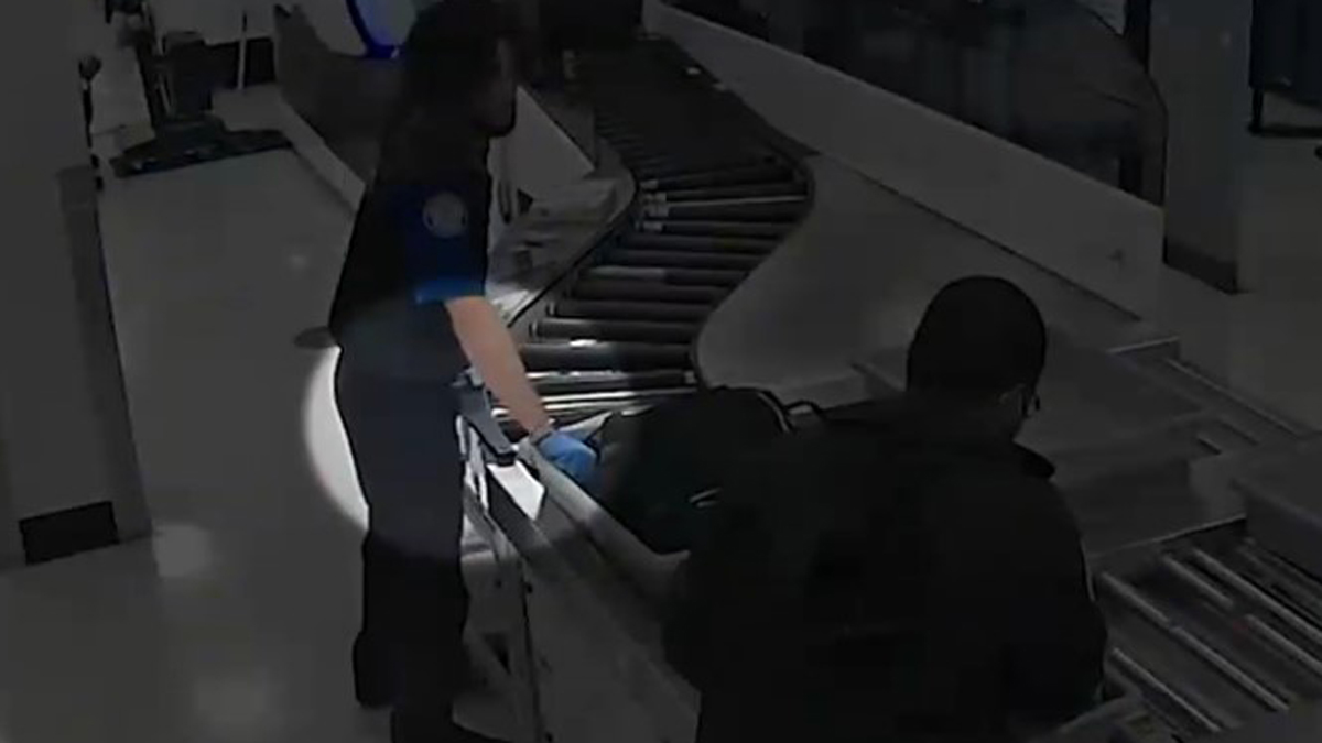 New surveillance footage appears to show Transportation Security Administration officers at Miami International Aiport going through travelers' bags a