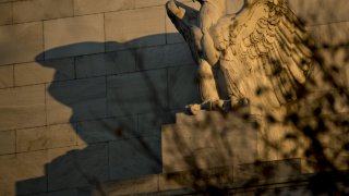 An eagle sculpture stands on the facade of the Marriner S. Eccles Federal Reserve building in Washington, D.C.