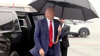 Former U.S. President Donald Trump, who was arraigned on federal charges related to attempts to overturn his 2020 election defeat, faces reporters as he departs Washington at Reagan Washington National Airport in nearby Arlington, Virginia, U.S., August 3, 2023. 