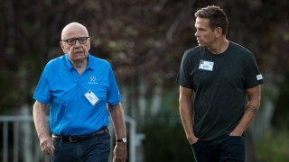 (L to R) Rupert Murdoch, executive chairman of News Corp and chairman of Fox News, and Lachlan Murdoch, co-chairman of 21st Century Fox, walk together as they arrive on the third day of the annual Allen & Company Sun Valley Conference, July 13, 2017 in Sun Valley, Idaho.