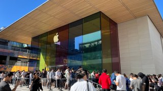 Hundreds of people lined up at a flagship Apple store in Beijing to pick up the new iPhone 15 when deliveries began on Friday.