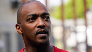 Actor Anthony Mackie speaks outside a home while working with GAF Roofing Academy students who were volunteering to replace the roof of Joe Capers, who has lived in New Orleans since the 1950s, in New Orleans, Tuesday, Sept. 12, 2023.