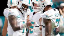 Dolphins pour it on with 70-20 rout over Broncos