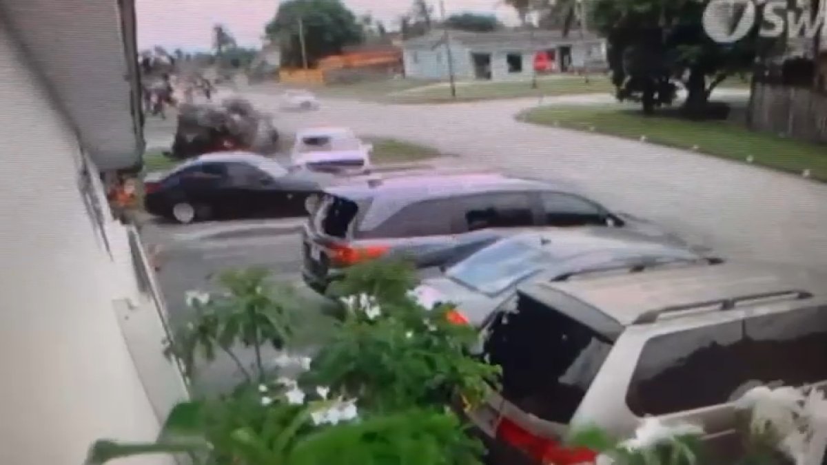 Surveillance video shows moment police chase ends in rollover crash in ...