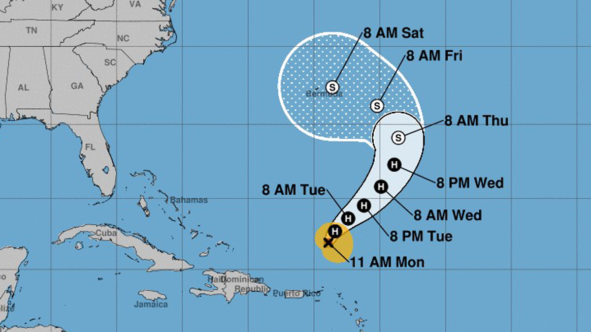 Hurricane Tammy spins into open waters as large waves pound northern