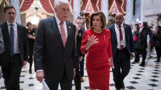 Former House Speaker Nancy Pelosi and ex-Majority Leader Steny Hoyer walk from the House floor where members debate the United States-Mexico-Canada Agreement to the speaker’s office in the U.S. Capitol in Washington, D.C., on Dec. 19, 2019.