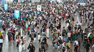 Passengers wait for trains at Guangzhou South Railway Station on Sept. 27, 2023, just days before the National Day and Mid-Autumn Festival holidays.