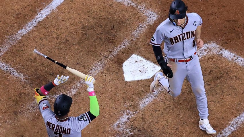 Arizona Diamondbacks players score a run